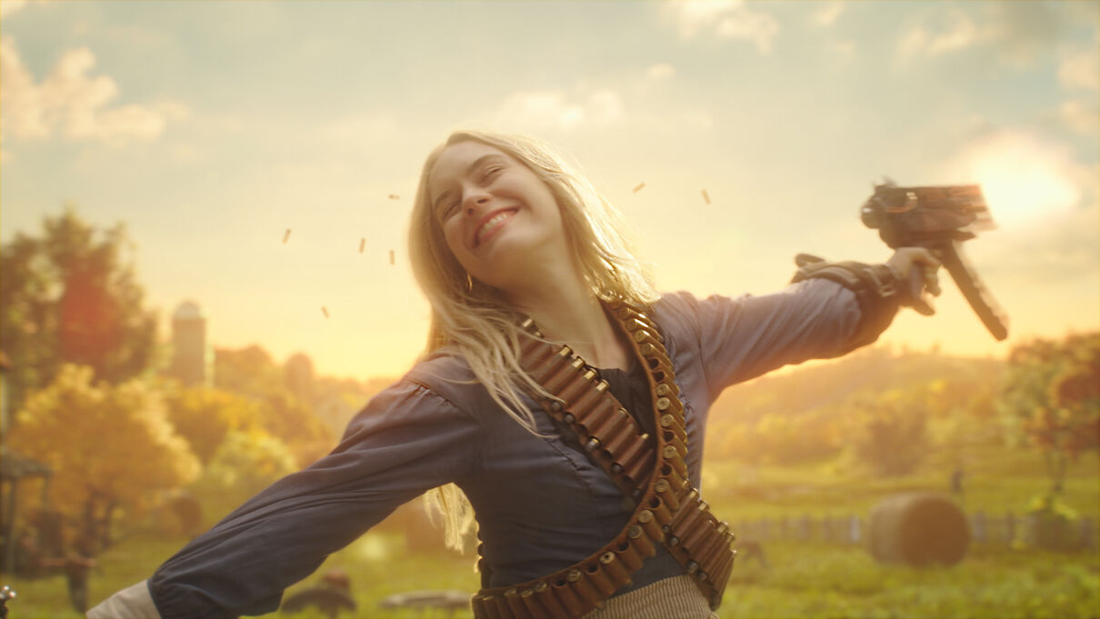Girl smiling and spinning while firing a gun